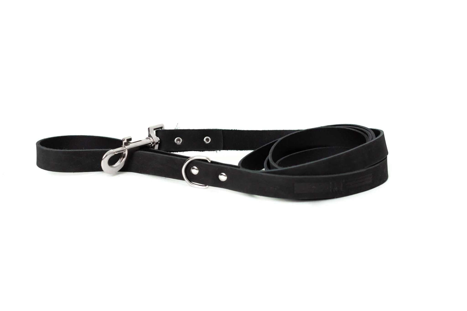 Euro-Dog Collars and Leads hanging on a rack in a pet boutique