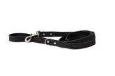 Euro-Dog Collars and Leads hanging on a rack in a pet boutique